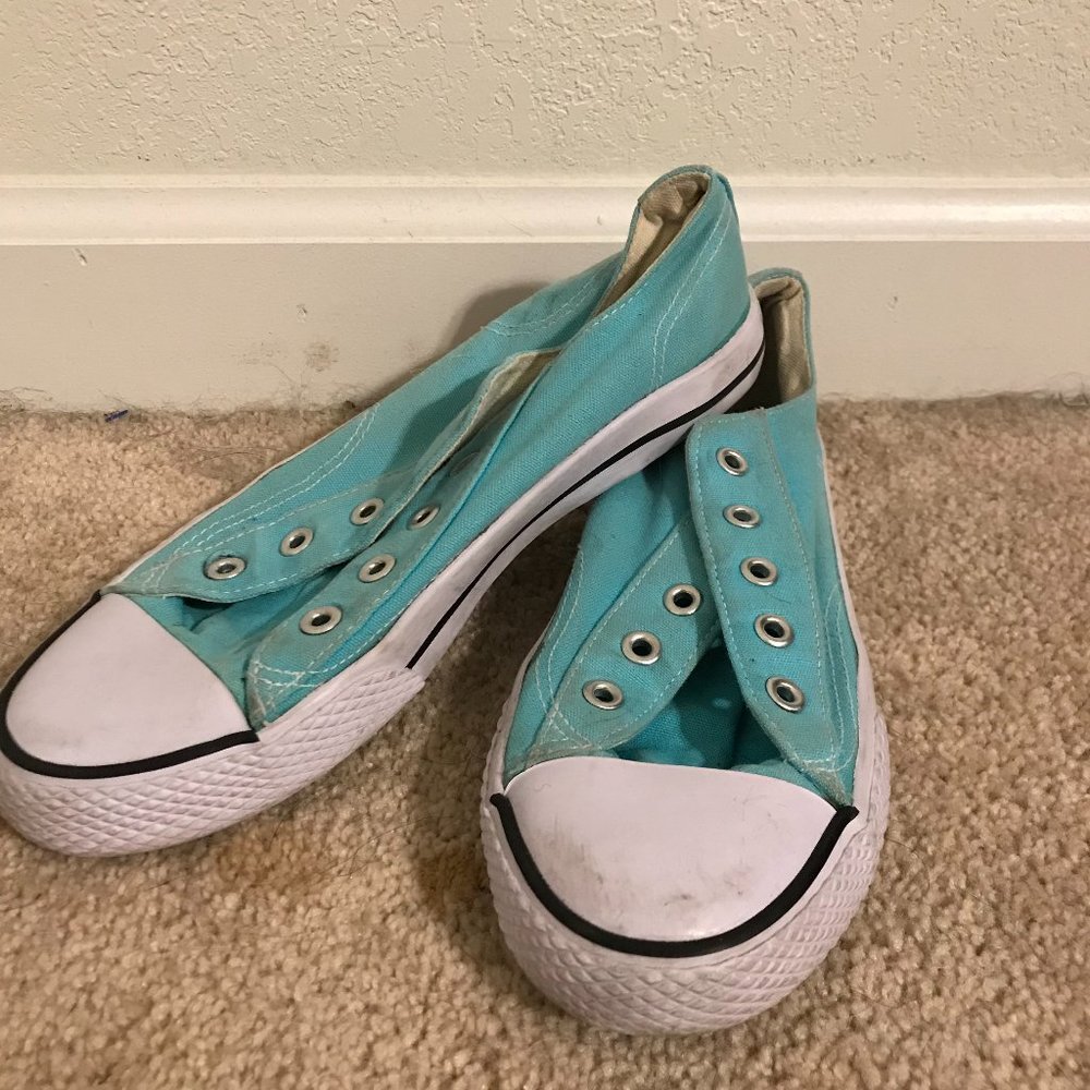 A pair of turquoise Airwalk tennis shoes